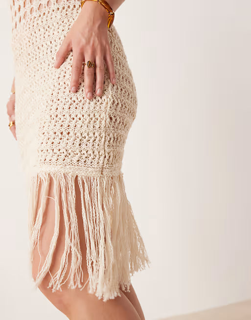 Knitted stitch crochet mini dress with fringe detail in stone